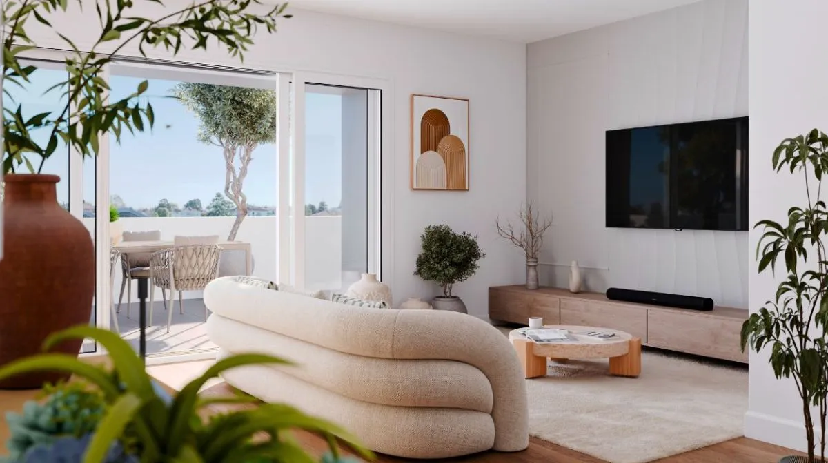 Perspective d’un salon spacieux à Cap A Vita, combinant confort et élégance avec une décoration contemporaine et des ouvertures sur un espace vert.