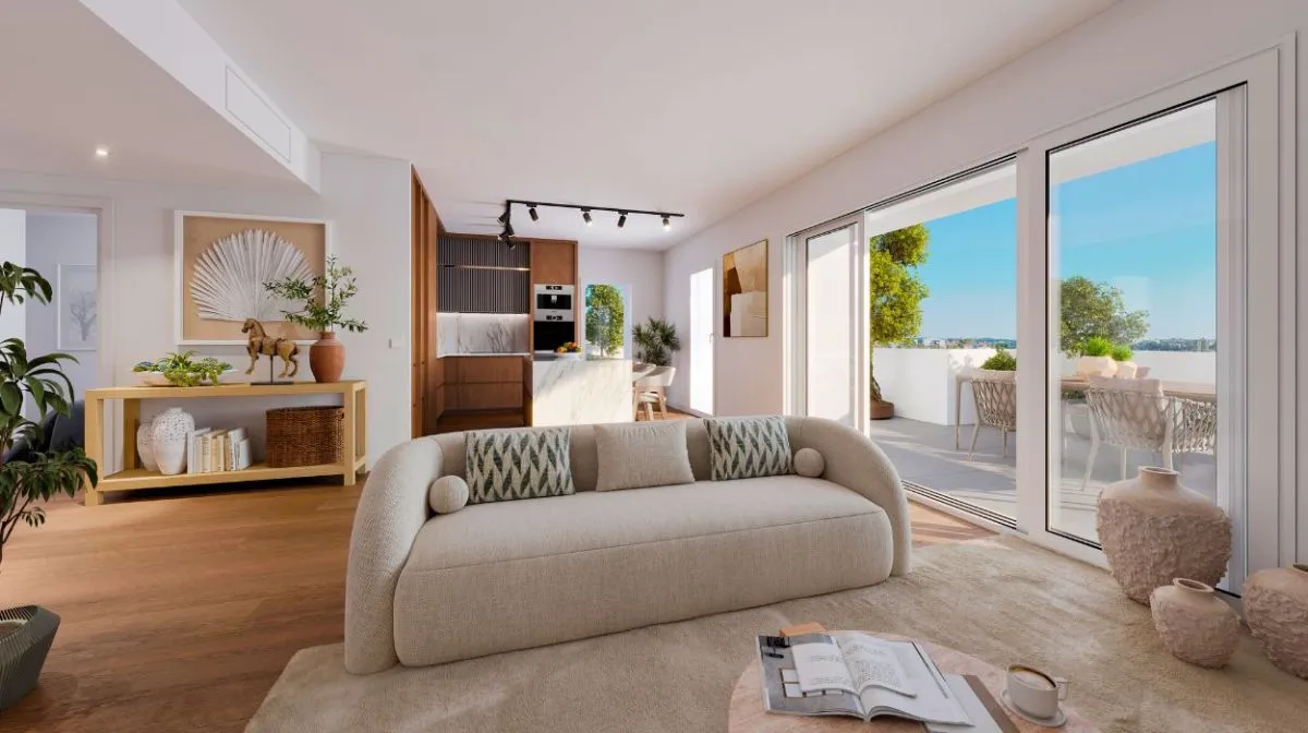 Vue intérieure d’un appartement lumineux à Cap A Vita, avec un design moderne, des finitions haut de gamme et une grande baie vitrée donnant sur une terrasse.