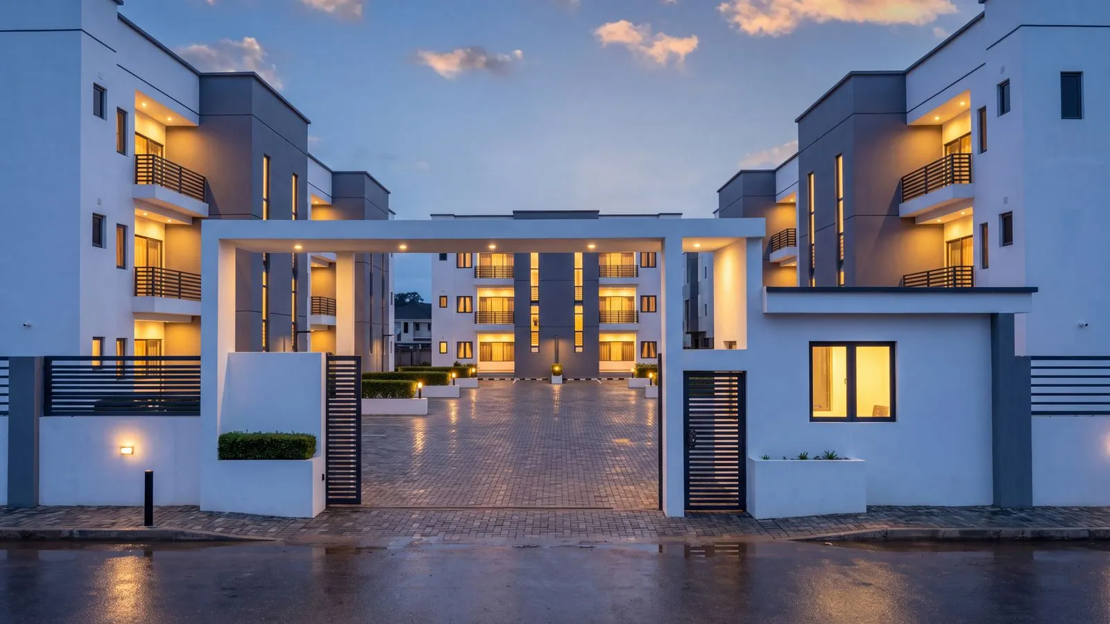 Design visualisation of the Belleville gate at dusk, the gatehouse lit and the houses glowing inside