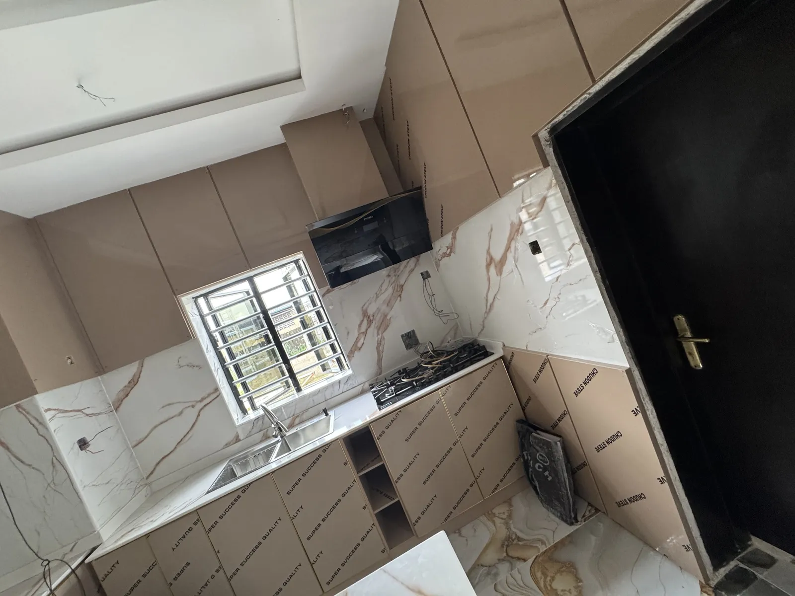 Side perspective of modern kitchen counter layouts with integrated stove top burners and minimalist accent lighting fixtures