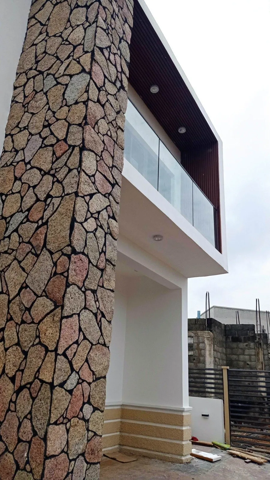 Stone clad facade detail at Wiser Court, Abuja