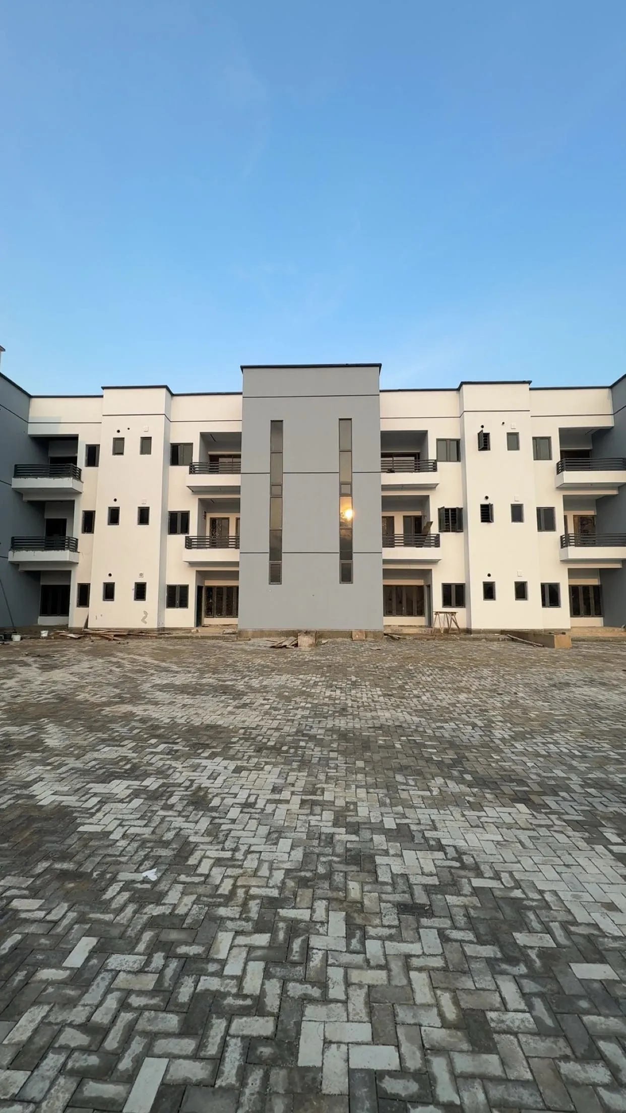 Paved courtyard in front of the completed rows at Belleville Estate