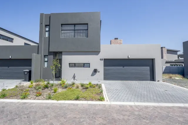 Greystone exterior with garden
